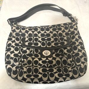 Gently used black and cream logo Coach bag.